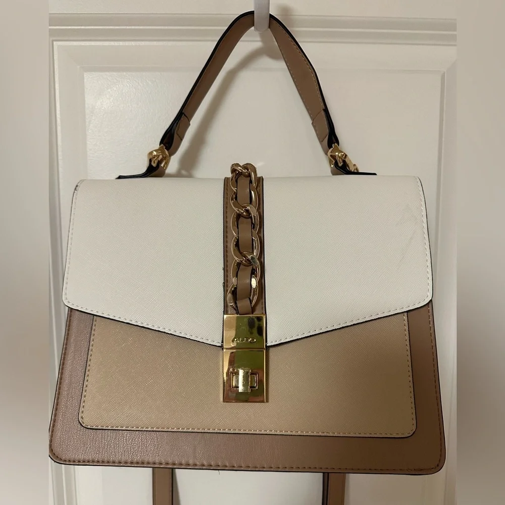 ALDO women's handbag with a top handle and chain detail.